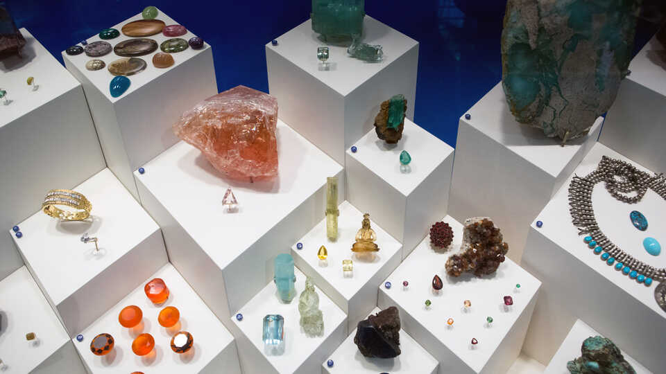 Colorful cut and raw gems and minerals on exhibit at the Academy